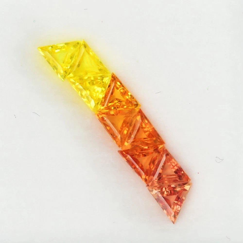1.27ct ETW Orange Yellow Sapphire Gemstone Lot – Trillion Cut (9 Pcs)