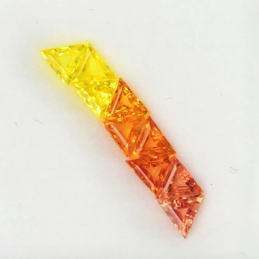 1.27ct ETW Orange Yellow Sapphire Gemstone Lot – Trillion Cut (9 Pcs)