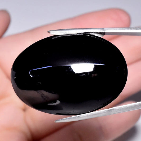100.59ct ETW Natural Black Pyroxene Gemstone – Oval Cabochon